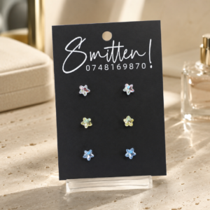 Three pairs of star-shaped crystal stud earrings.